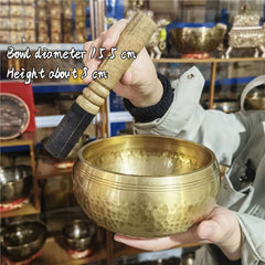 Tibetan brass singing bowl with Sanskrit – handmade meditation instrument for stress relief.