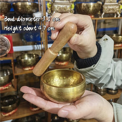 Tibetan brass singing bowl with Sanskrit – handmade meditation instrument for stress relief.