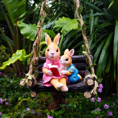 Simulated rabbit reading animal ornament
