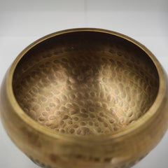 Tibetan brass singing bowl with Sanskrit – handmade meditation instrument for stress relief.