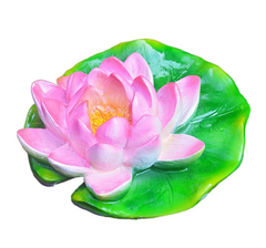 Turtle resin ornaments floating on the water surface