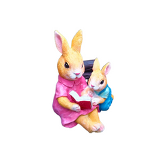Simulated rabbit reading animal ornament