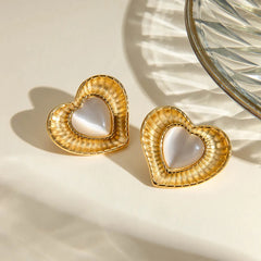 White cat eye stone earrings with niche temperament titanium steel earrings