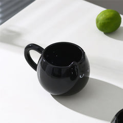 Adorable hand - painted cat - shaped ceramic mug, perfect for coffee or tea.